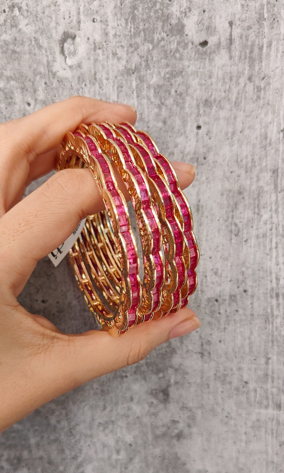 Sabr stone bangles in pink with gold-tone finish