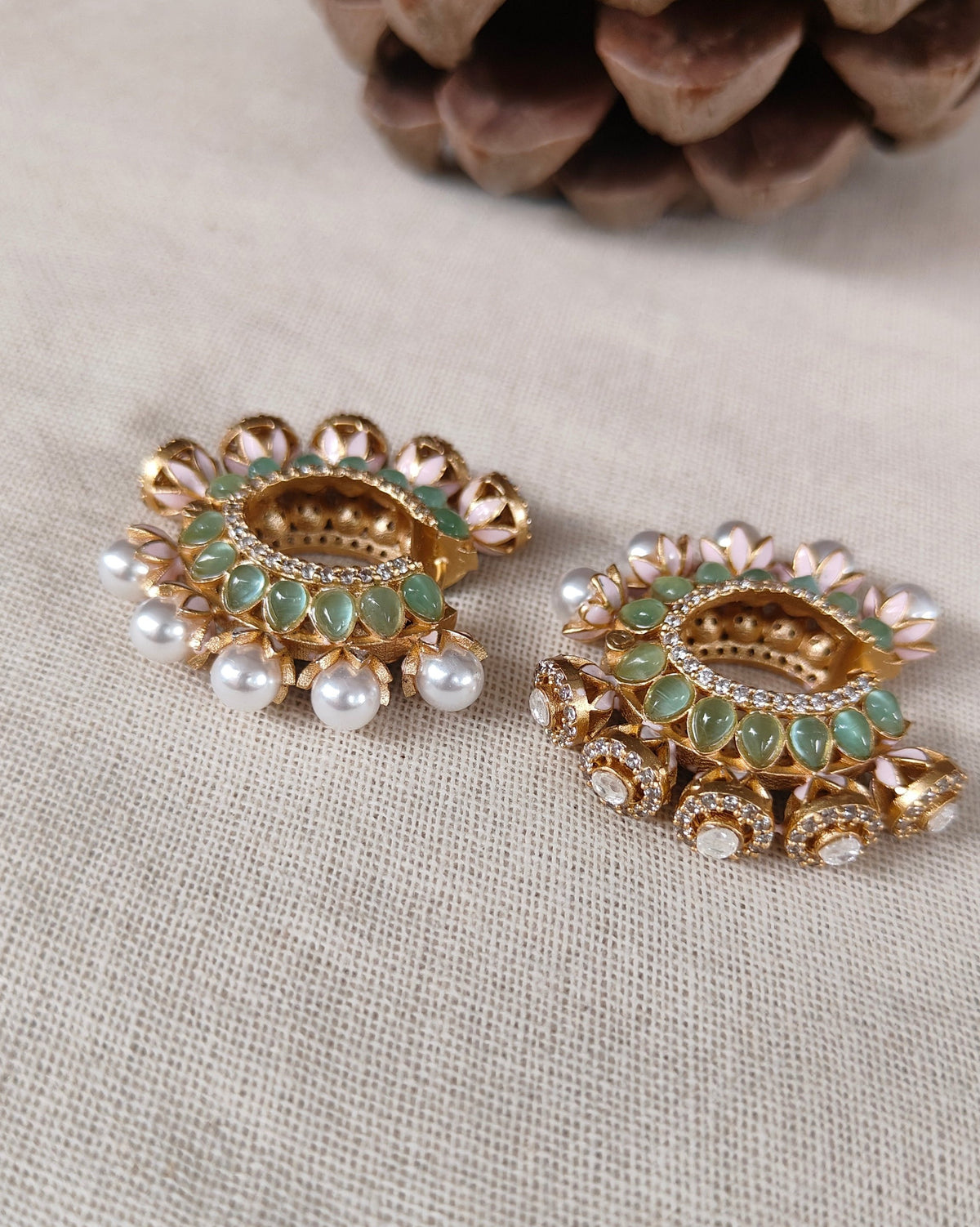 Green kundan chandbali hoop earrings close-up showing jadau stone work