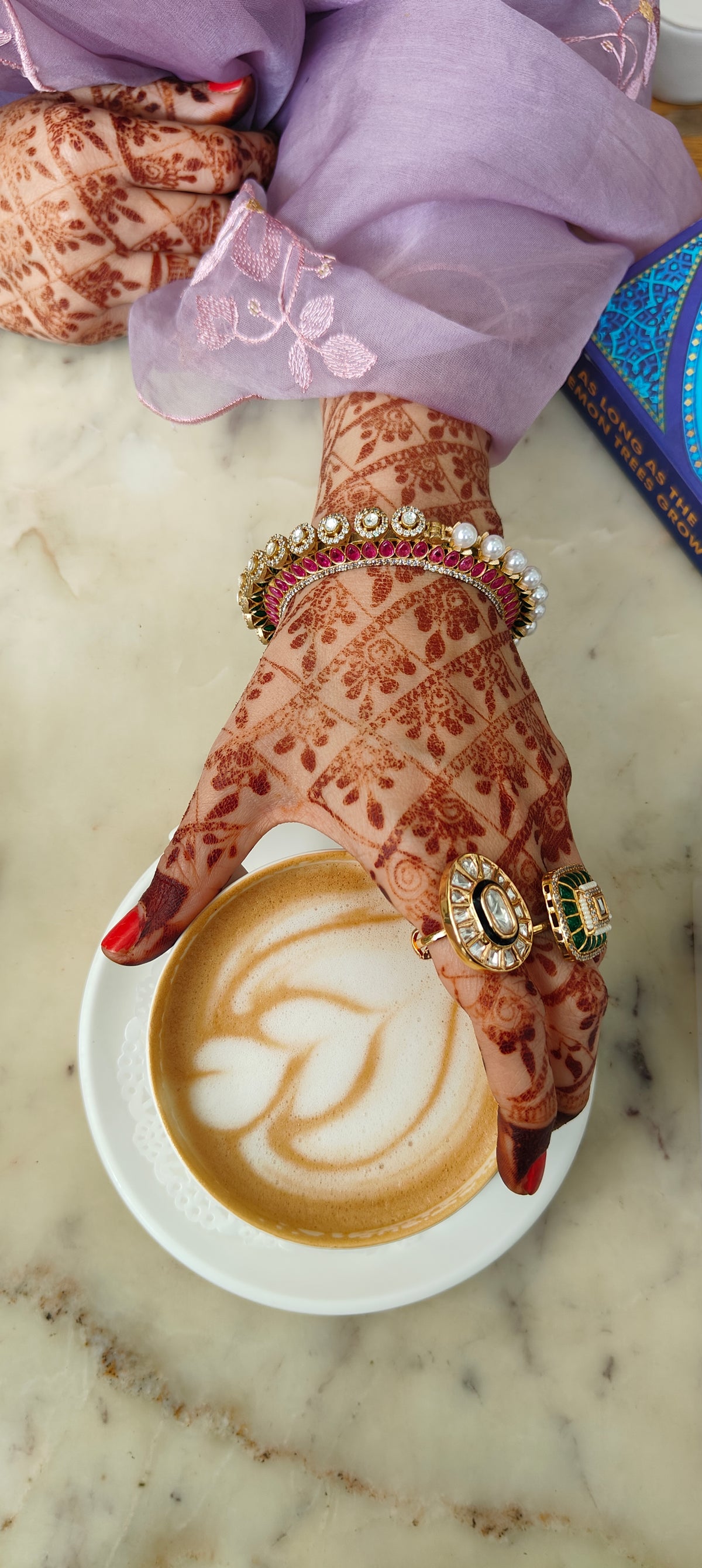 Pink polki bangle detail showing uncut stones and pearls