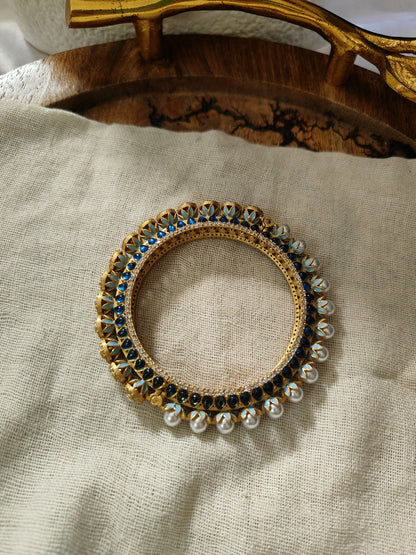 Amrapali blue polki and pearl openable gold bangle, front view