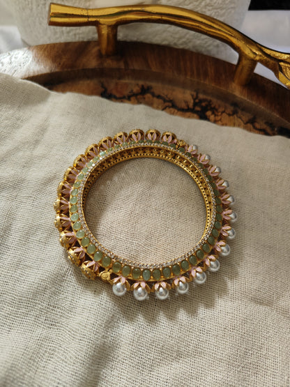 Mint green polki bangle with uncut stones and pearls close-up